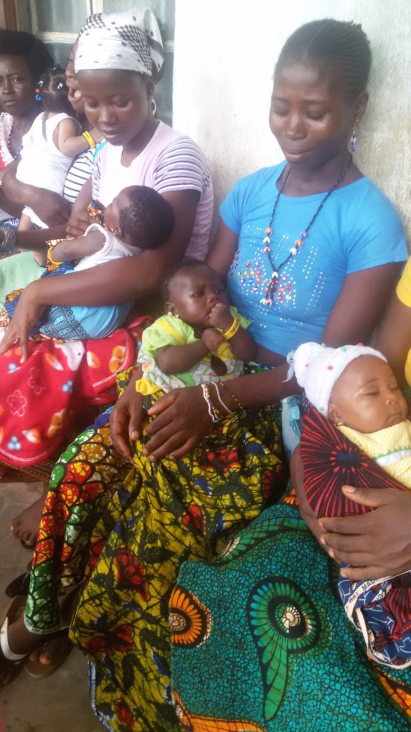 Photo: Mothers waiting with their babies for vaccinations. 